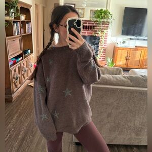 Brown crewneck sweater with silver star accent
